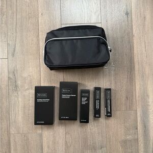 Bundle of Revision Skincare Products with Black Travel Toiletry Bag